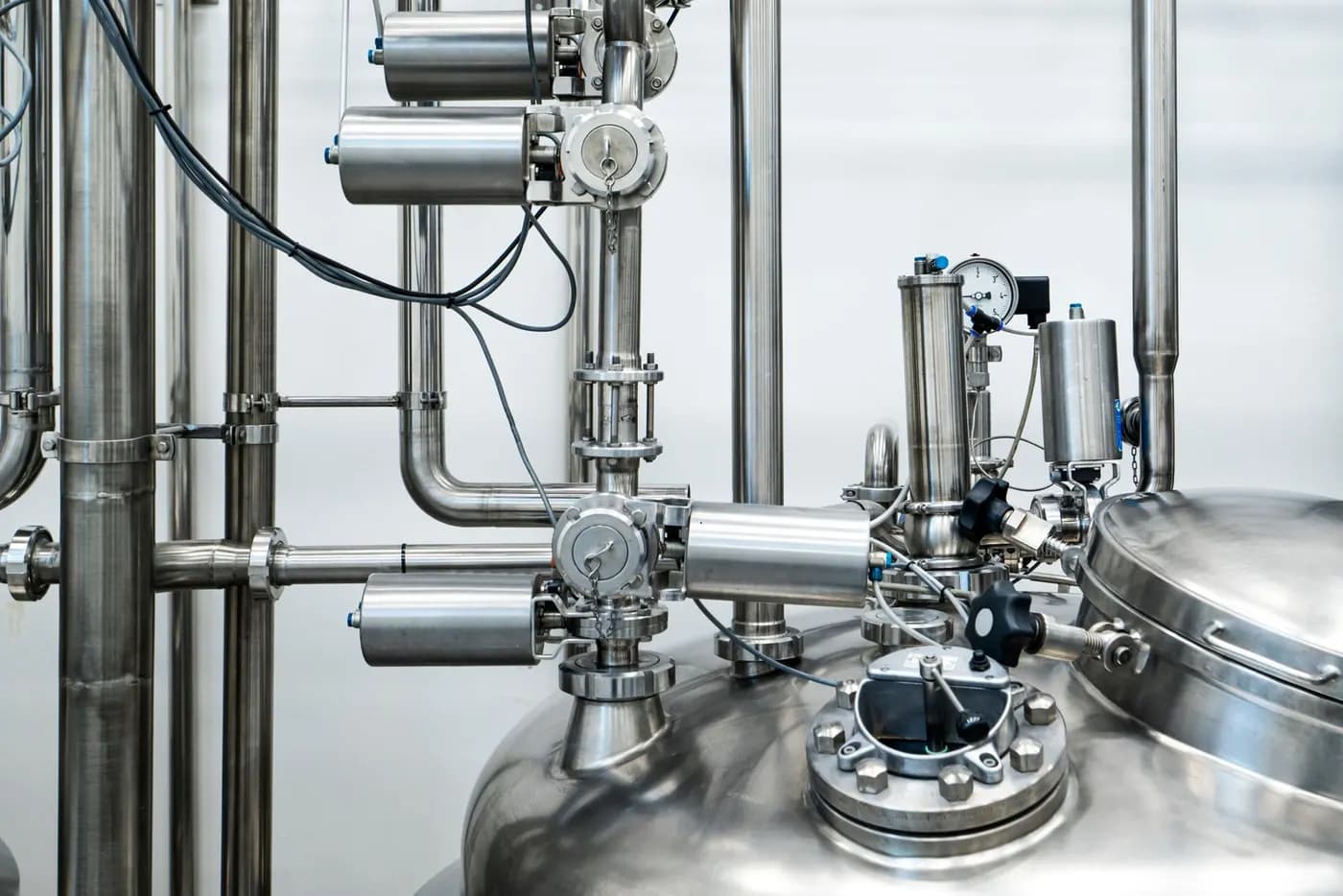 Stainless-steel pharmaceutical process equipment with valves and gauges